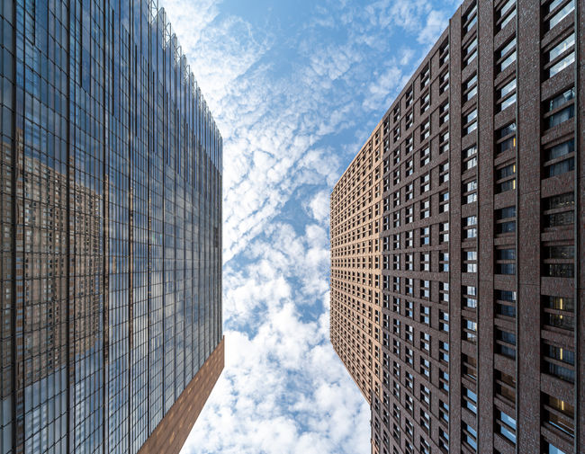 Low angle view of modern buildings against sky
