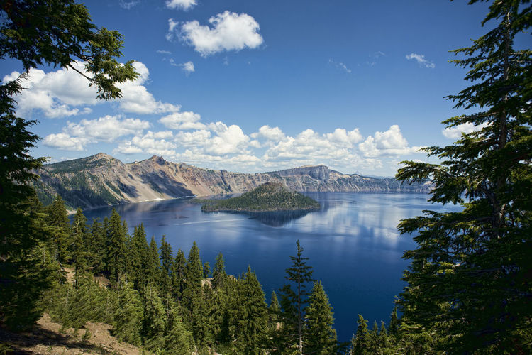 Scenic view of crater lake against blue sky