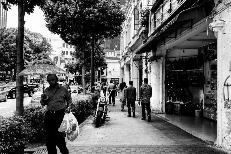 People walking on street in city
