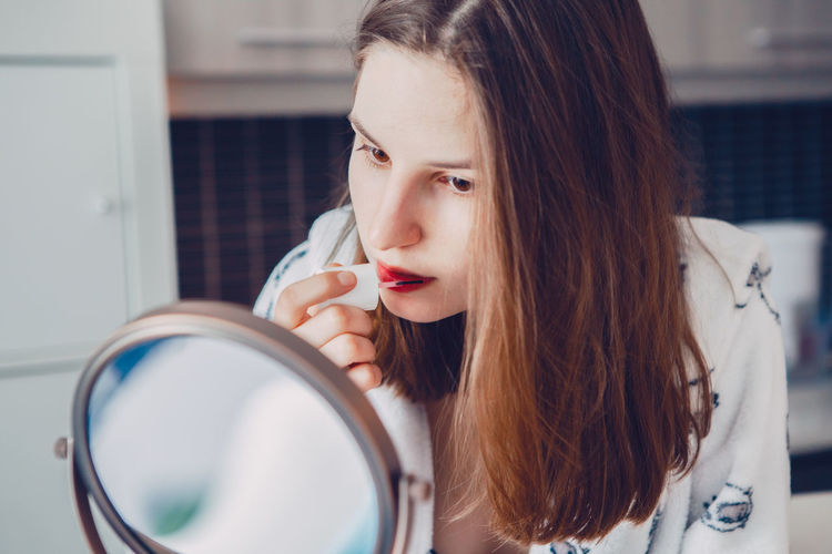 Portrait of young woman looking at camera