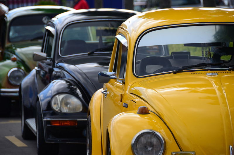 Close-up of cars on road