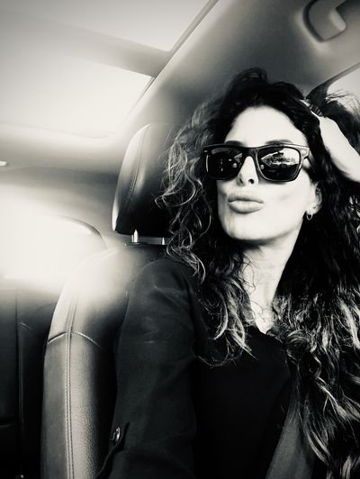 Portrait of beautiful woman in car