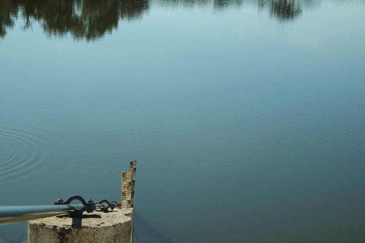 High angle view of depth marker in lake