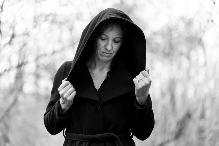 Mid adult woman in black bathrobe