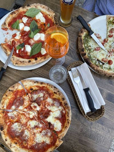 High angle view of pizza served on table