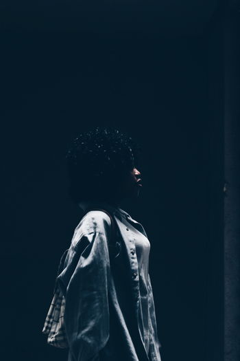 Dark story told in the light Black Background EyeEm Market 2017 Portrait Women Africa EyeEm Gallery Canon Camera Moody Teenagers The Week On EyeEm Indoors Close-up Standing Casual Clothing EyeEmNewHere Cold Temperature One Person