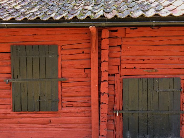 Red door of brick wall