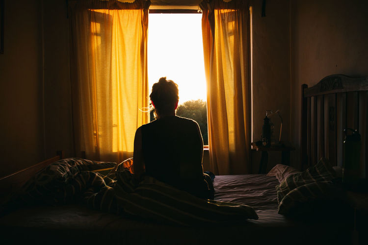 Morning light through the window Bright Comfortable Curtain Dark Women Around The World Girl Glow Home Light Meditate Meditation Morning 43 Golden Moments Resting Time Reflection Reflections Relaxation Resting Sitting Sunrise Sunset Sunshine Thinking Window The Week On EyeEm Long Goodbye Resist The Secret Spaces Sommergefühle