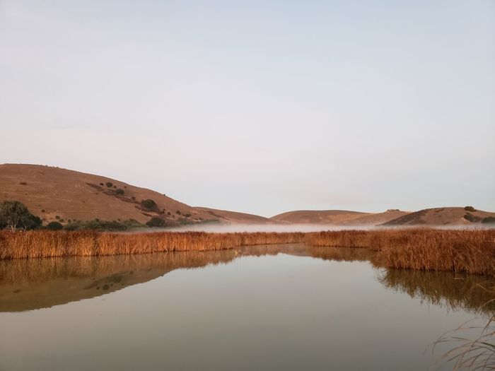 Scenic view of lake against clear sky