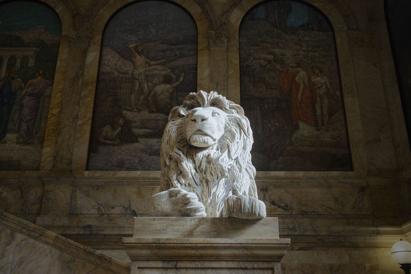 Low angle view of statue against building