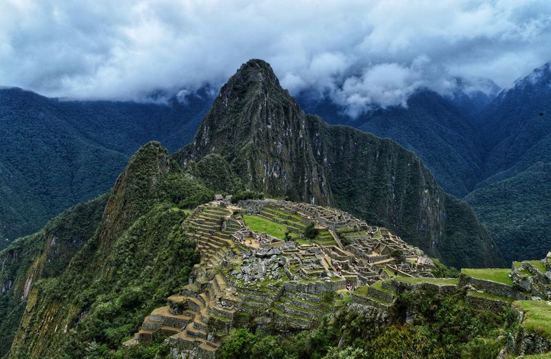 High angle view of ruins of mountain against cloudy sky