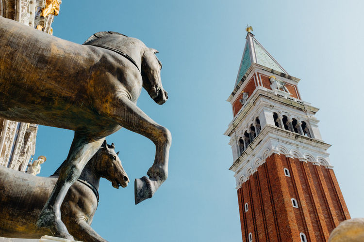 Low angle view of statue and tower at church of san giorgio maggiore