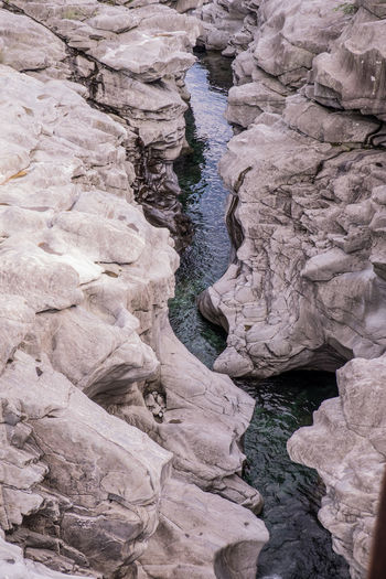 High angle view of stream amidst rock formations