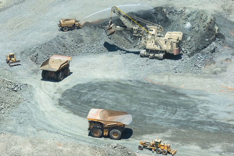 Electric rope shovel loading a dump trucks at a copper mine in chile