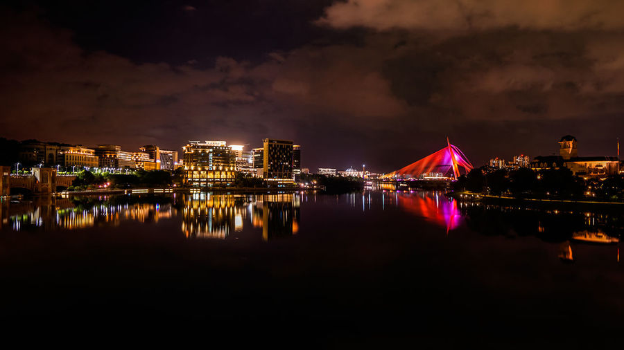 Illuminated buildings in city at night