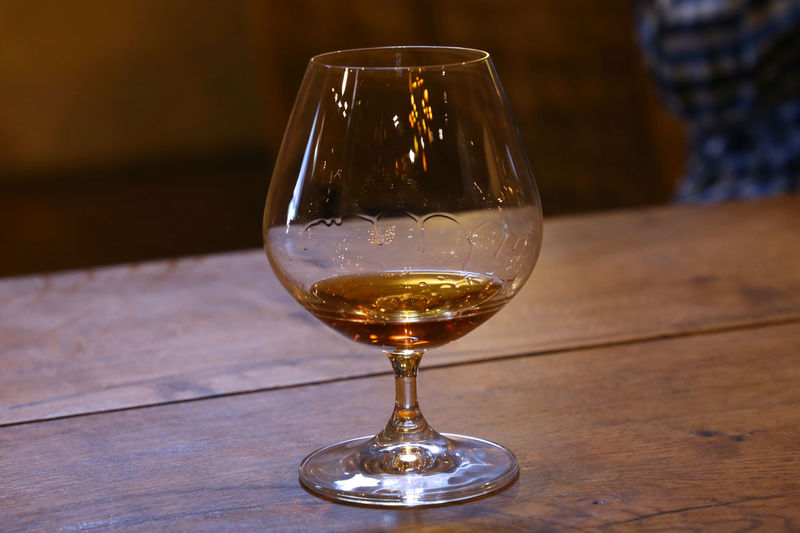Close-up of brandy in glass on table