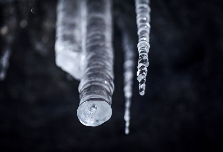 Close-up of icicles hanging outdoors