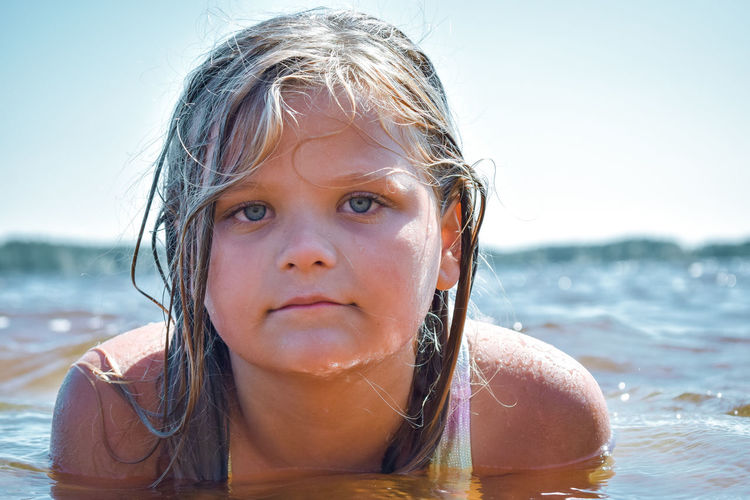 Close-up portrait of girl at beach