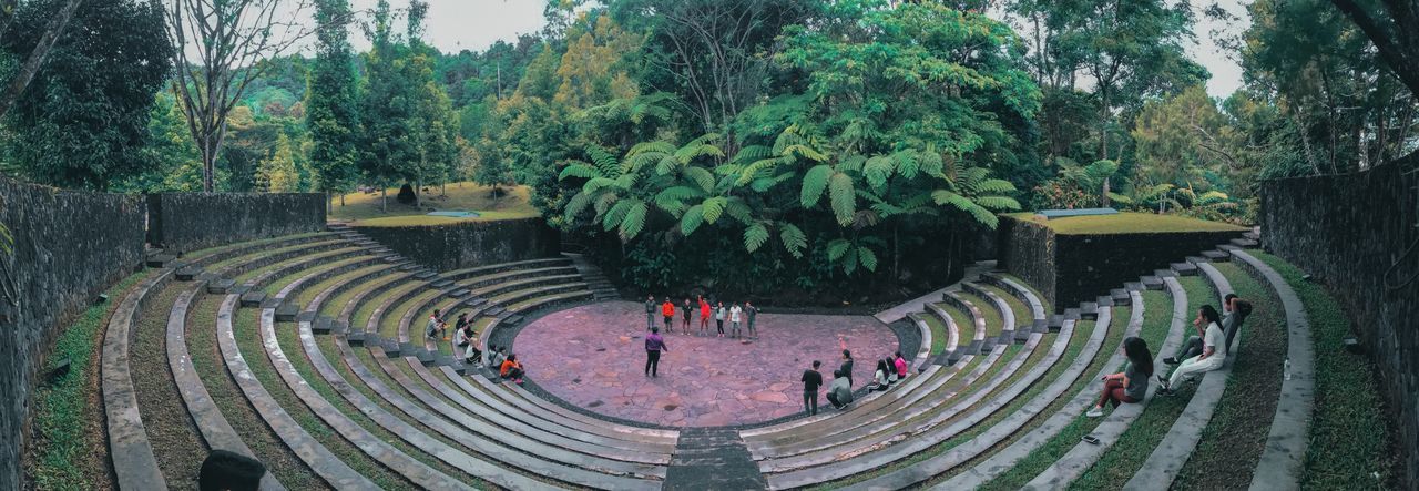 High angle view of people in amphitheater against trees