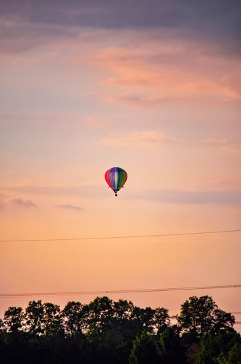 Hot air balloon against sky during sunset