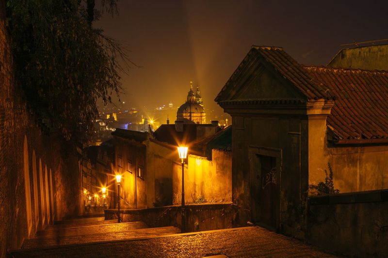Illuminated building against sky at night