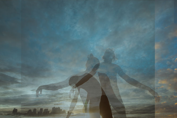 Digital composite image of people dancing against sky
