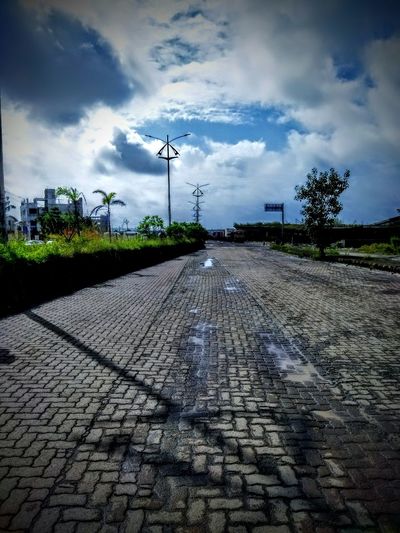 Surface level view of street against sky