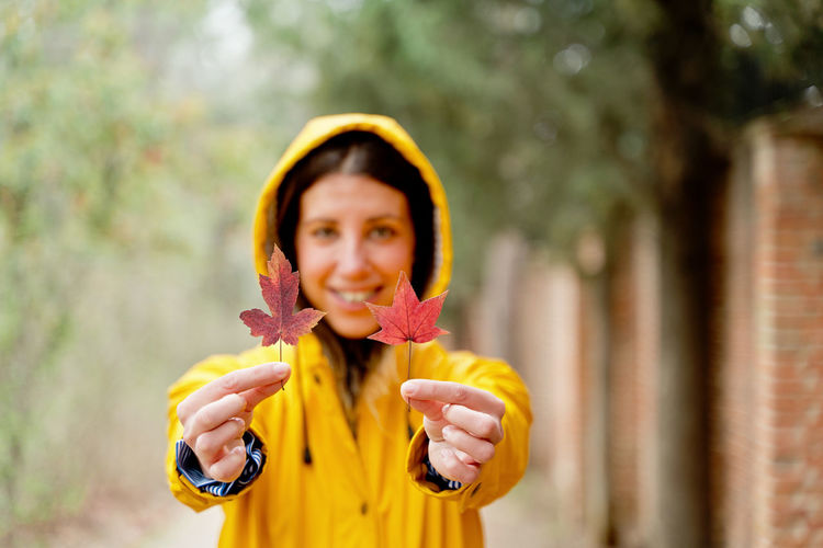 Young woman holding flower