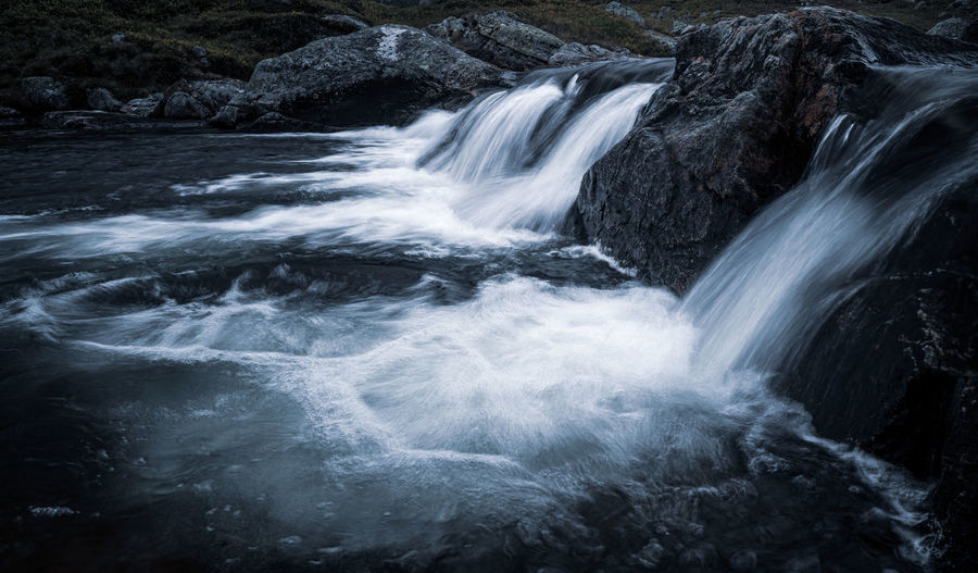 Row of small waterfalls in a nordic highland landscape.