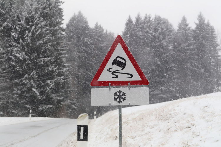 Warning traffic sign in winter