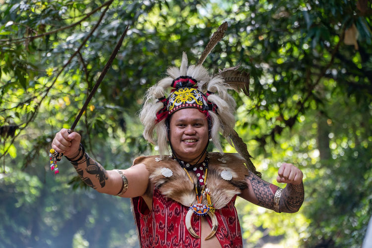 The action of a borneo dayak warrior