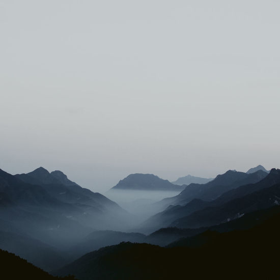 Scenic view of silhouette mountains against sky