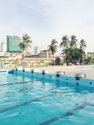 View of swimming pool against blue sky