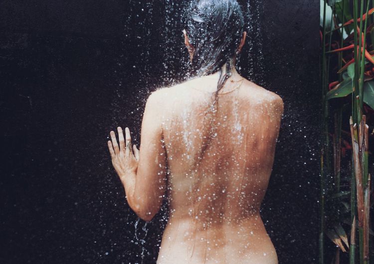 Rear view of a woman in water