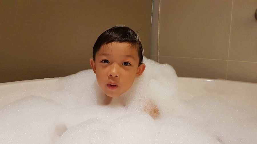 Portrait of boy in bathtub