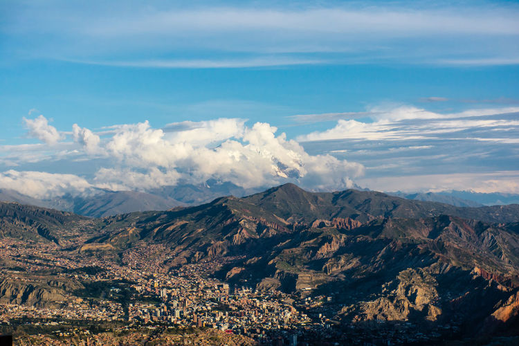 Aerial view of clouds over mountain range