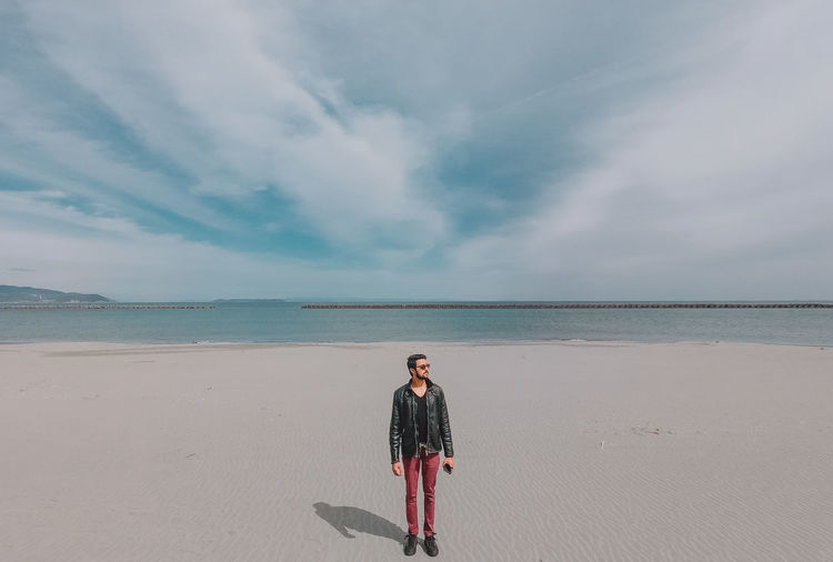 Full length of man standing at beach