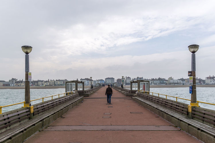 People walking on pier