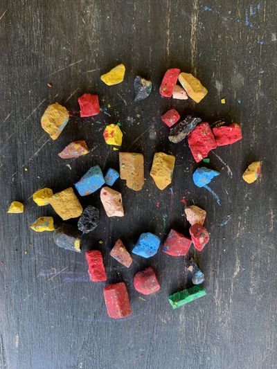 High angle view of multi colored candies on wooden table