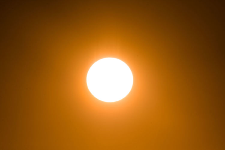 Scenic view of sun against sky during sunset