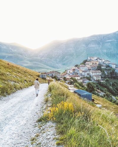Woman looking at mountain landscape