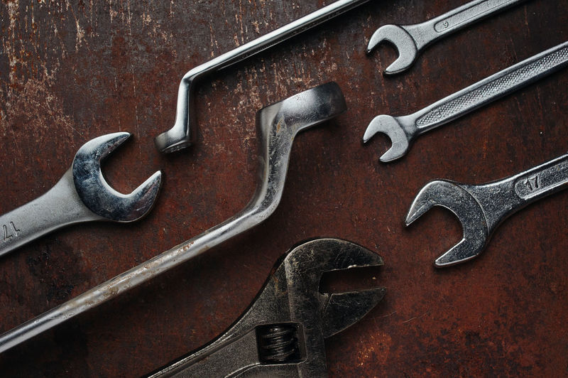 Close-up of rusty metal tools on table