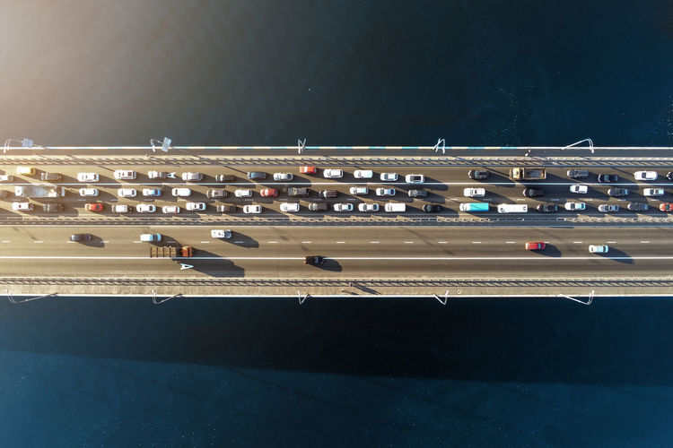 Aerial view of cars on bridge over sea