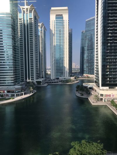 River amidst buildings in city