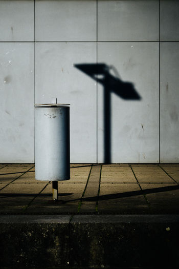 Shadow on wall by footpath