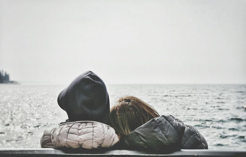 Rear view of couple looking at sea