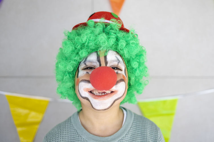 Close-up portrait of smiling boy with face paint