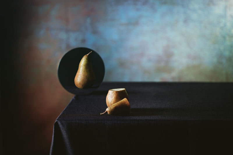 Close-up of pear fruit on table