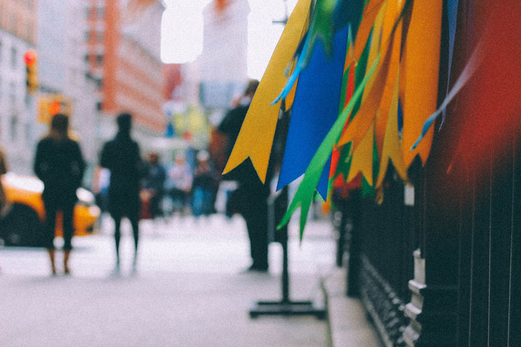 Close-up of ribbons on railing