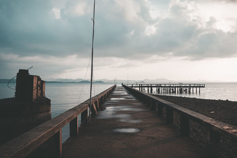 Pier over sea against sky